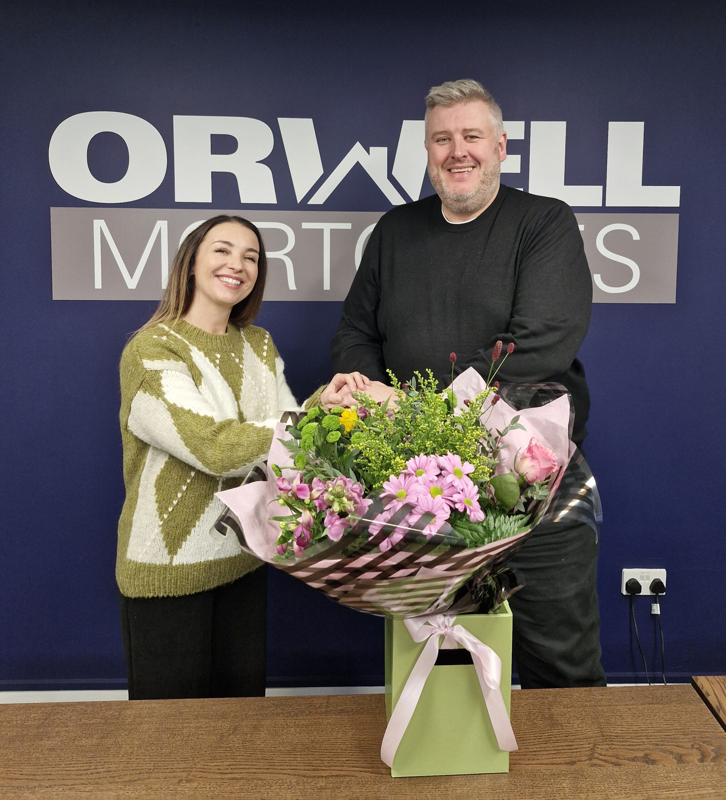Orwell Mortgages £500 referral winner Rachel receiving flowers in Ipswich, Suffolk
